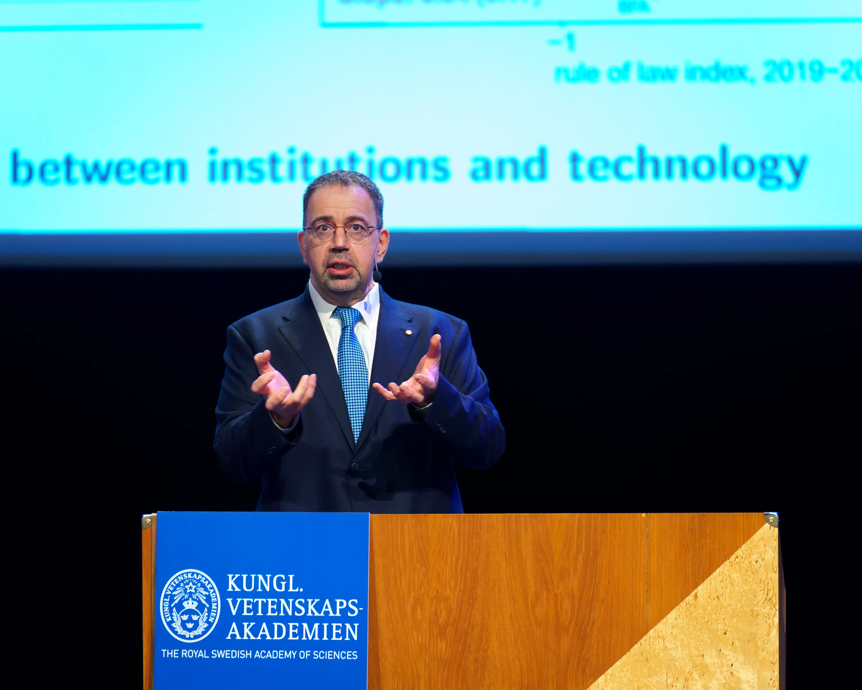 Daron Acemoglu speaking at the 2024 Nobel Lectures in Stockholm