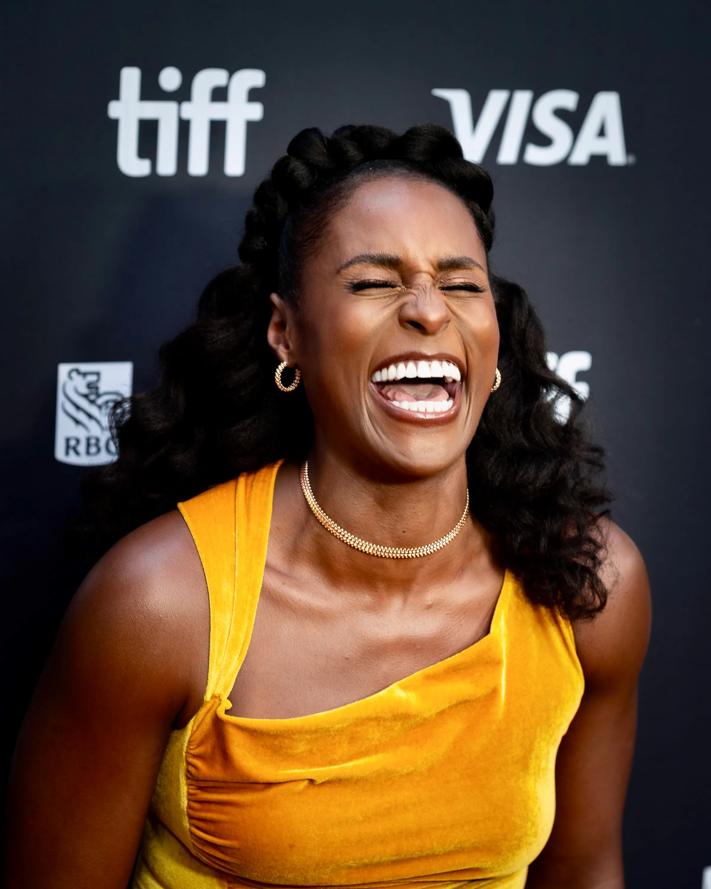 Issa Rae laughing with her head tilted back at the Toronto International Film Festival in 2026