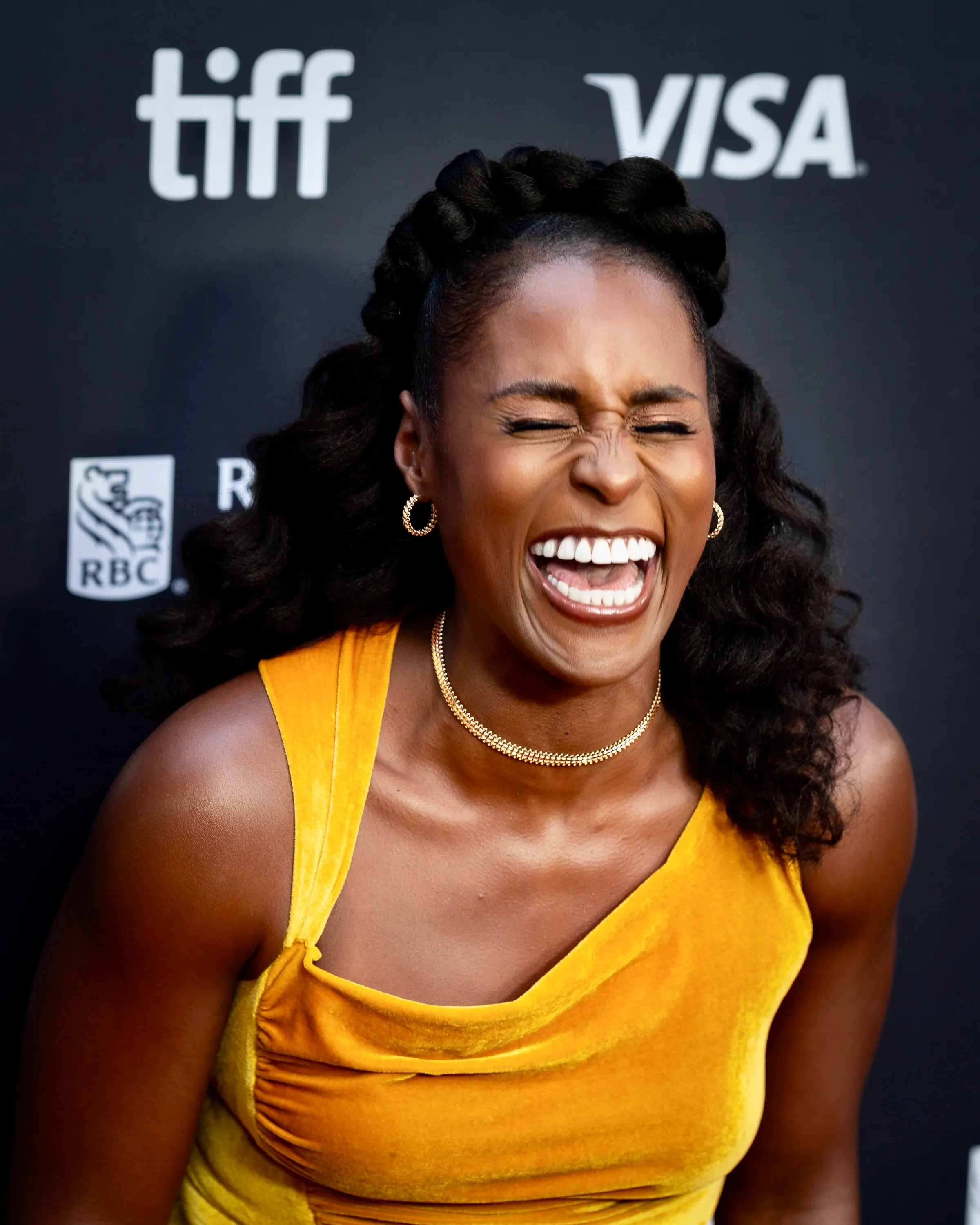 Issa Rae laughing with her eyes closed at the Toronto International Film Festival in 2026