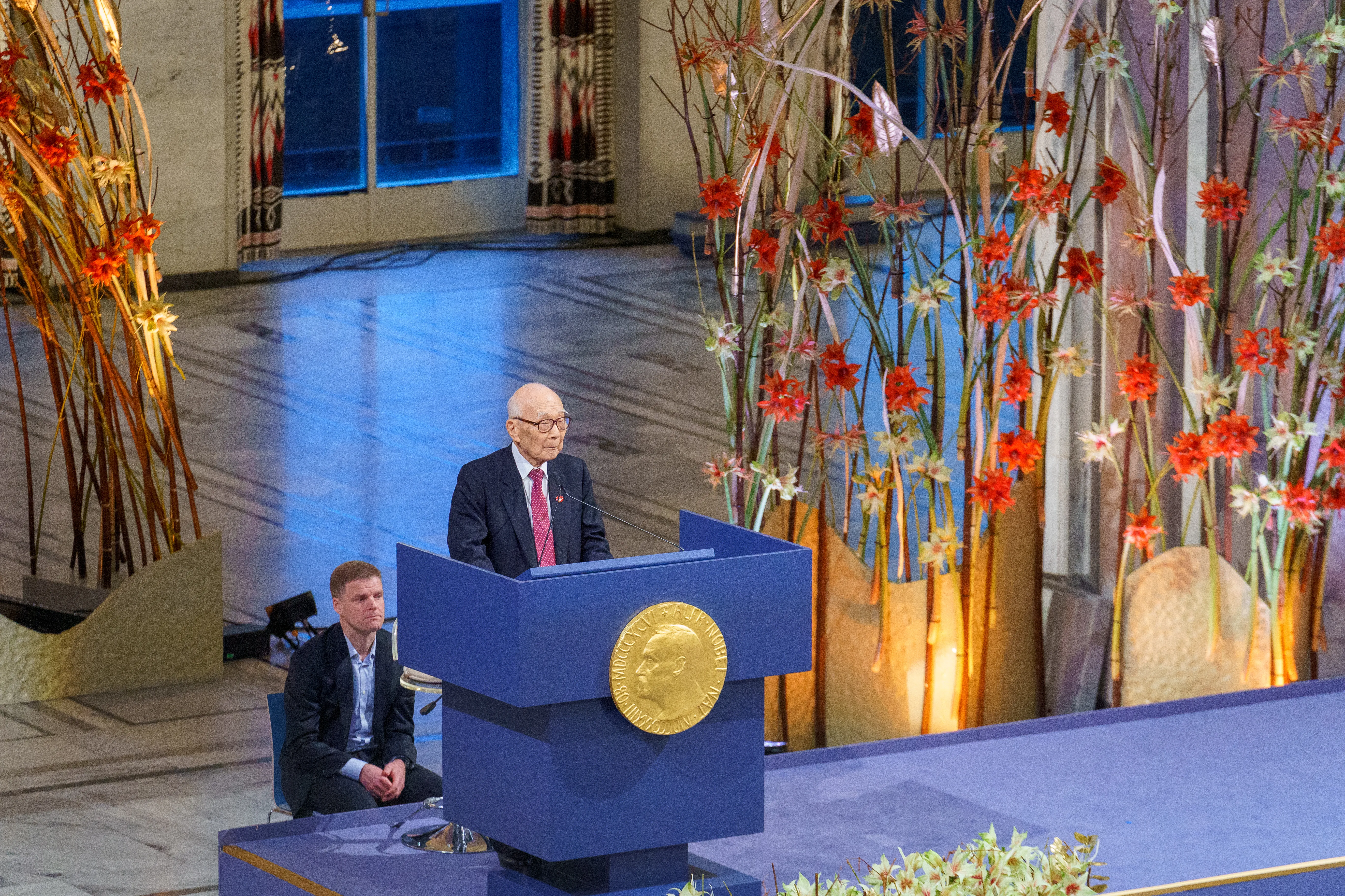 A Nobel Peace Prize recipient speaking at a podium during the 2024 ceremony in Oslo